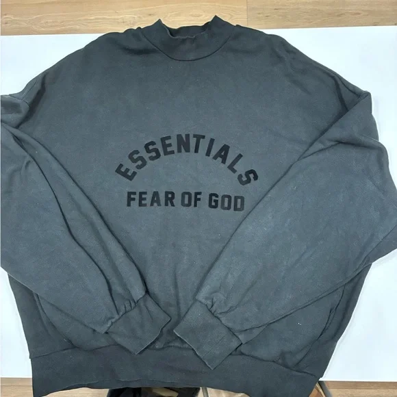 This is a Fear of God Essentials black sweatshirt. - Picture 2 of 7